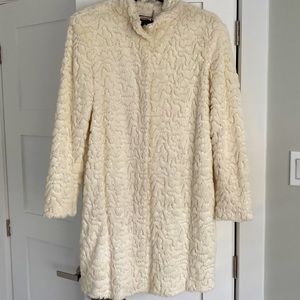 Beautiful Autumn and Spring coat. In an off white, faux fur, with tiny sequins.